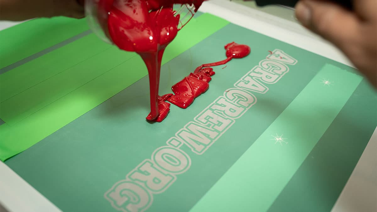 Custom screen printed t-shirts being produced at Rolled Up Tees shop in Nyack NY