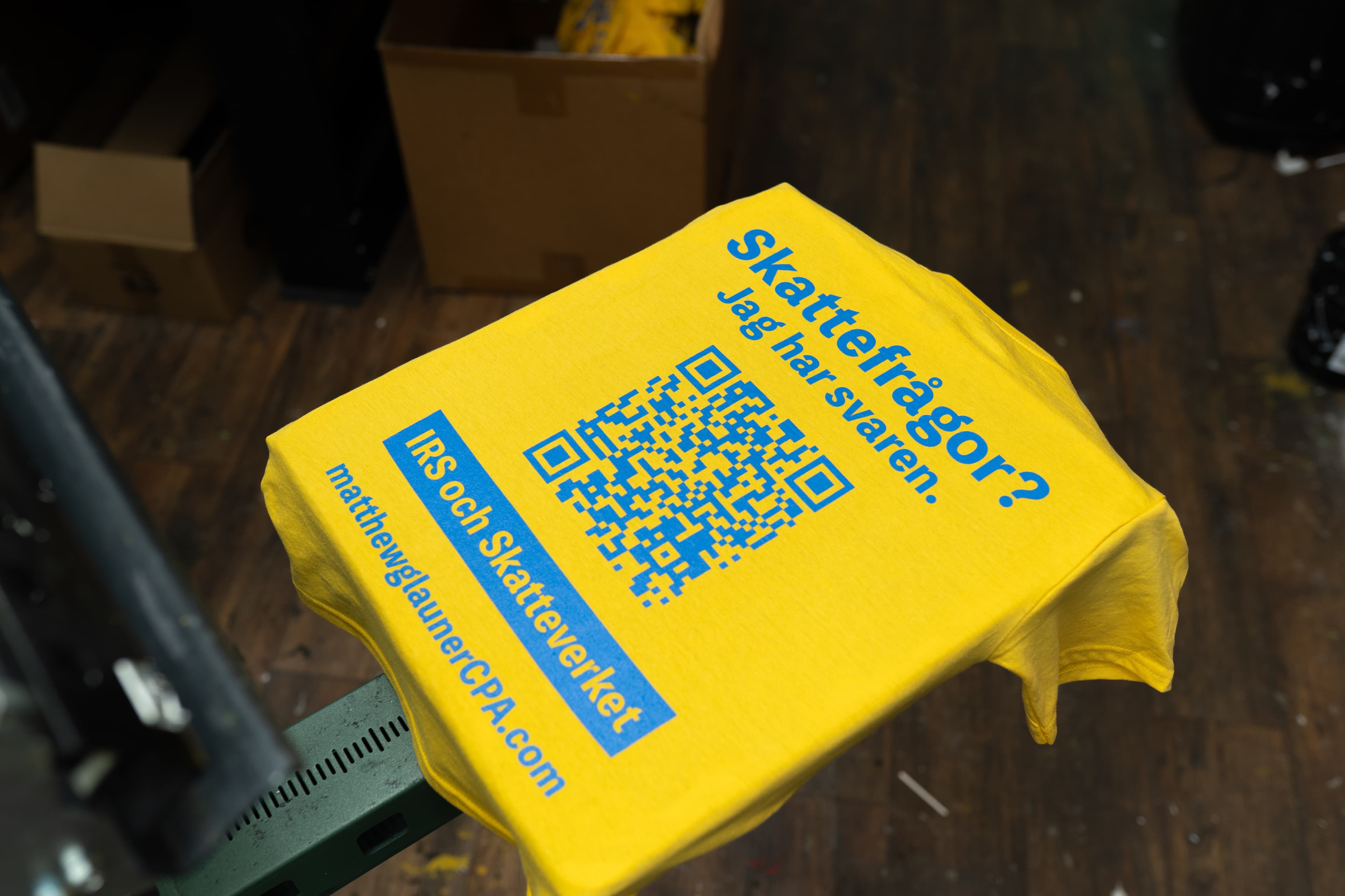 Screen printing setup showing ink colors and press at Rolled Up Tees in Nyack NY